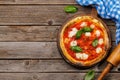 Margarita pizza with tomatoes, mozzarella cheese and basil Royalty Free Stock Photo