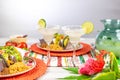 Margaritas with salt and limes and mexican food Royalty Free Stock Photo