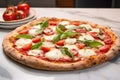 a margherita pizza with fresh ingredients tomatoes, mozzarella, basil on a marble countertop Royalty Free Stock Photo