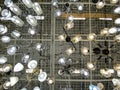 Mari El, Russia - July 21, 2021: Lamps in the store on the ceiling. Bottom-up view, vertical. A large selection. Prices are in