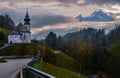 Maria Gern pilgrimage church and mount Watzmann top silhouette through fog, Berchtesgaden, Germany Royalty Free Stock Photo