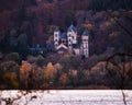 Maria Laach Abbey surrounded by colorful trees Royalty Free Stock Photo