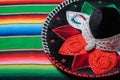 Mariachi hat with the colors of the Mexican flag on a colorful serape