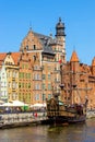 Mariacka Gate and Archeological Museum along the Hanseatic houses pier at Motlawa river embankment in old town city center in Royalty Free Stock Photo