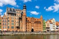 Mariacka Gate and Archeological Museum along the Hanseatic houses pier at Motlawa river embankment in old town city center in Royalty Free Stock Photo