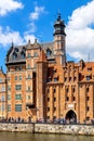 Mariacka Gate and Archeological Museum along the Hanseatic houses pier at Motlawa river embankment in old town city center in Royalty Free Stock Photo