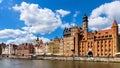 Mariacka Gate and Archeological Museum along the Hanseatic houses pier at Motlawa river embankment in old town city center in Royalty Free Stock Photo