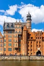 Mariacka Gate and Archeological Museum along the Hanseatic houses pier at Motlawa river embankment in old town city center in Royalty Free Stock Photo