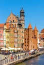 Mariacka Gate and Archeological Museum along the Hanseatic houses pier at Motlawa river embankment in old town city center in Royalty Free Stock Photo