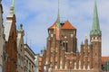 Mariacka street with colorful facades of tenement houses and St.Mary`s Church, Gdansk, Poland Royalty Free Stock Photo