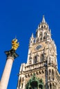 Marian column 1639 or Mariensaule with statue of Virgin Mary on the top and Neues Rathaus, Munich, Germany