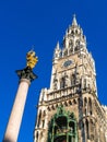 Marian column 1639 or Mariensaule with statue of Virgin Mary on the top and Neues Rathaus, Munich, Germany