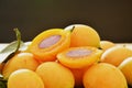 Marian plum tropical fruit produced in summer half cut on black background Royalty Free Stock Photo