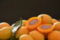 Marian plum tropical fruit produced in summer half cut on black backgroung Royalty Free Stock Photo