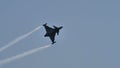 Military fighter jet airplane in blue sky