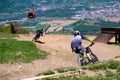 Downhill mountain bikers riding down the trail on Pohorje near Maribor, Slovenia Royalty Free Stock Photo