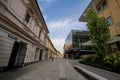 Gosposka Ulica street with people passing by boutiques and shops in Maribor.