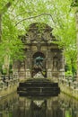 Marie De Medicis Fountain among trees in Luxembourg Gardens in Paris, France Royalty Free Stock Photo