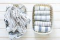 Marie Kondo tidying concept - folded kitchen linens in white basket Royalty Free Stock Photo