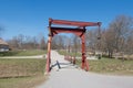 Red wooden bridge across the moat of Gripsholm Castle in a sunny day, Mariefred, Sweden. Royalty Free Stock Photo