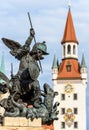 Marienplatz Square detail, Munich, Germany. Statue of angel closeup on background of Altes Rathaus or Old Town Hall Royalty Free Stock Photo