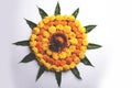 Hindu Festival decoration Flower rangoli using marigold and mango leaf