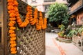 Marigold flowers and Goddess Lakshmi`s footprints at the entrance of the house. Kathmandy Royalty Free Stock Photo