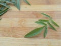 Marigold leaf on wooden background