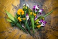 Marigold and orchid flowers in brass bowl