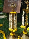 Marigold and Tuberose or Sugandaraja flower Decorated to the Brass Metal Traditional Oil Lamp at the Top Bird Shape