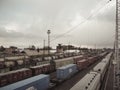 Long freight and passenger trains at the railway station of Mariinsk, Russia, on the Trans-Siberian railway