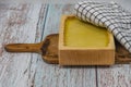 Marijuana butter with wooden mould on blue old table with checker dish towel Royalty Free Stock Photo