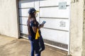 Census taker at the door of a house to collect data from the 2022 census in MarÃÂ­lia city