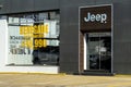 Jeep logo at a dealership. The subsidiaries of FCA are Chrysler, Dodge, Jeep, and Ram Royalty Free Stock Photo