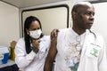 Nurse applies the H1N1 vaccine to a patient in the city of Marilia. Vaccination campaign against Influenza Royalty Free Stock Photo