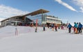 MARILLEVA. JAN 25, 2023. Rifugio Alpe Daolasa 2045m. Skiing area in the Dolomites Alps. A group of skiers in front of Rifugio Alpe