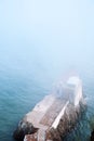 Marin headland old building and San Francisco bay on foggy day