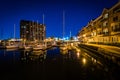 Marina and apartment buildings on the waterfront at night, in Ca Royalty Free Stock Photo