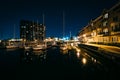 Marina and apartment buildings on the waterfront at night, in Ca Royalty Free Stock Photo