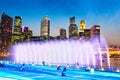 Marina Bay Fountain and Singapore Downtown Skyline at Night Royalty Free Stock Photo