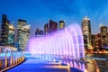 Marina Bay Fountain and Singapore Downtown Skyline at Night Royalty Free Stock Photo