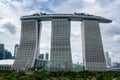 Marina Bay Sands Luxury Hotel in Singapore seen from OCBC Skyway walkway in Gardens by the Bay park.