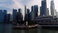 Marina Bay, Singapore May, 2018: View of business district and The Merlion Park. Moving clouds with Singapore city