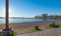 Marina & bay in St Antoni de Portmany, Ibiza, Balearic Islands, Spain. Calm water along boardwalk & beach in warm, late day sun Royalty Free Stock Photo