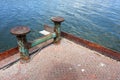 Marina bollard bitt at jetty for boats, ships and yachts mooring knecht cross Royalty Free Stock Photo