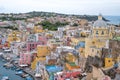 Marina Corricella, Italy, fishing village on the island of Procida with pastel coloured houses tumbling down the cliff to the se