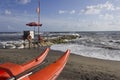 Lifeguard tower and rowing boat on the shoreline Royalty Free Stock Photo