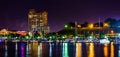 A marina and Federal Hill at night at the Inner Harbor in Baltimore, Maryland. Royalty Free Stock Photo