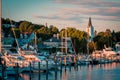 The Marina at Mackinac Island with Saint Anne`s church and the historic victorian houses a sunset shot from Lake Michigan