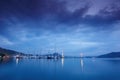 Marina at night with moored yachts